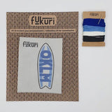 Matériel de broderie pour apprendre à broder un planche de surf soi-même tout en étant débutant grâce au support hydrosoluble.