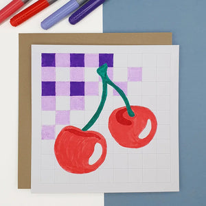 Carte créative au motif cerises sur fond à carreaux, à colorier ou peindre