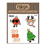 Planche à broder avec 4 motifs sur le thème de Noël. Renne, boule de noël, sapin de Noël et slogan HoHoHo